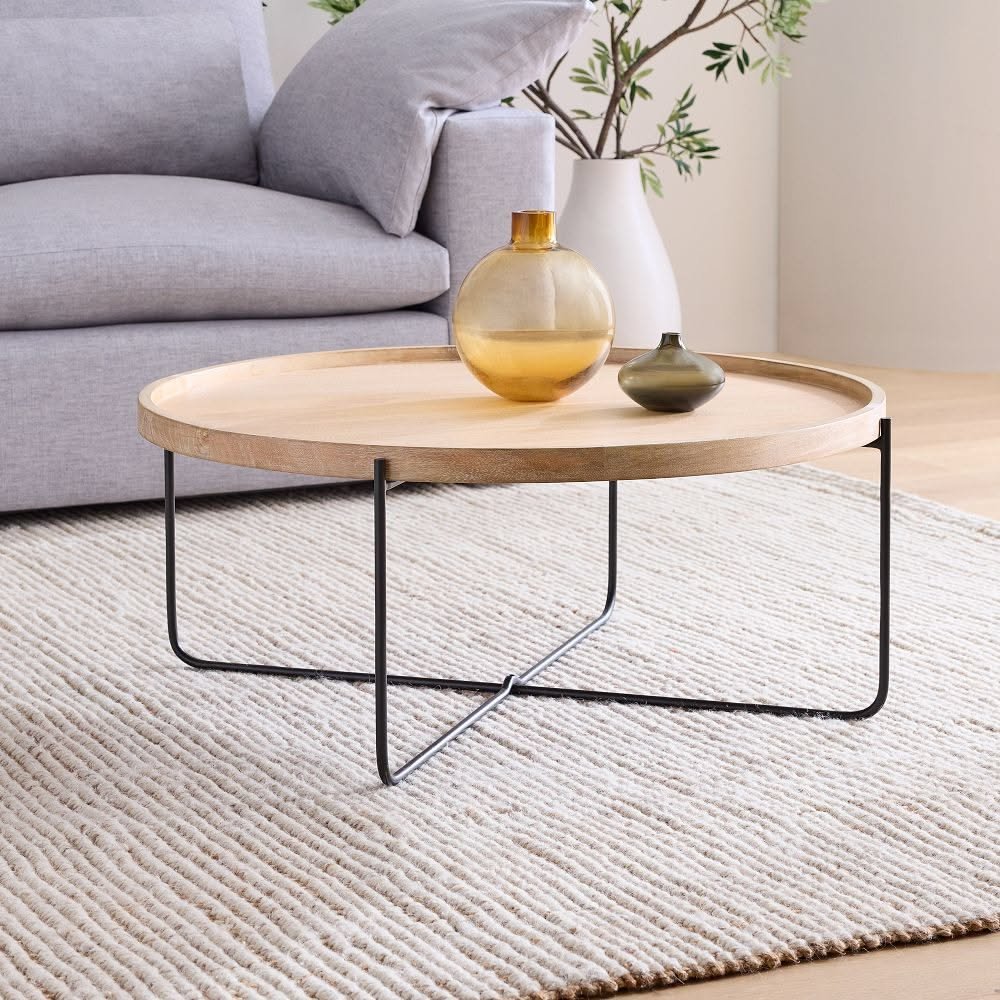 26 Round Coffee Table Ideas to Soften Your Living Room - 17. Layered Lighting 1