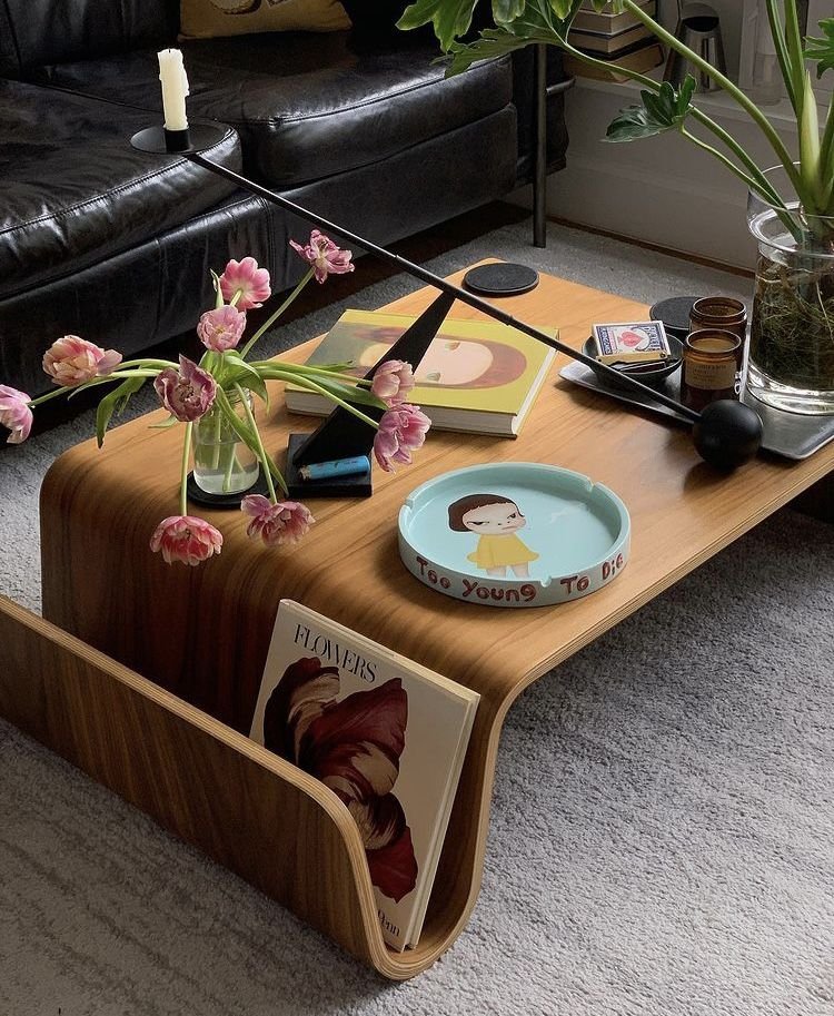 26 Round Coffee Table Ideas to Soften Your Living Room - 9. Artistic Statement Pieces 1