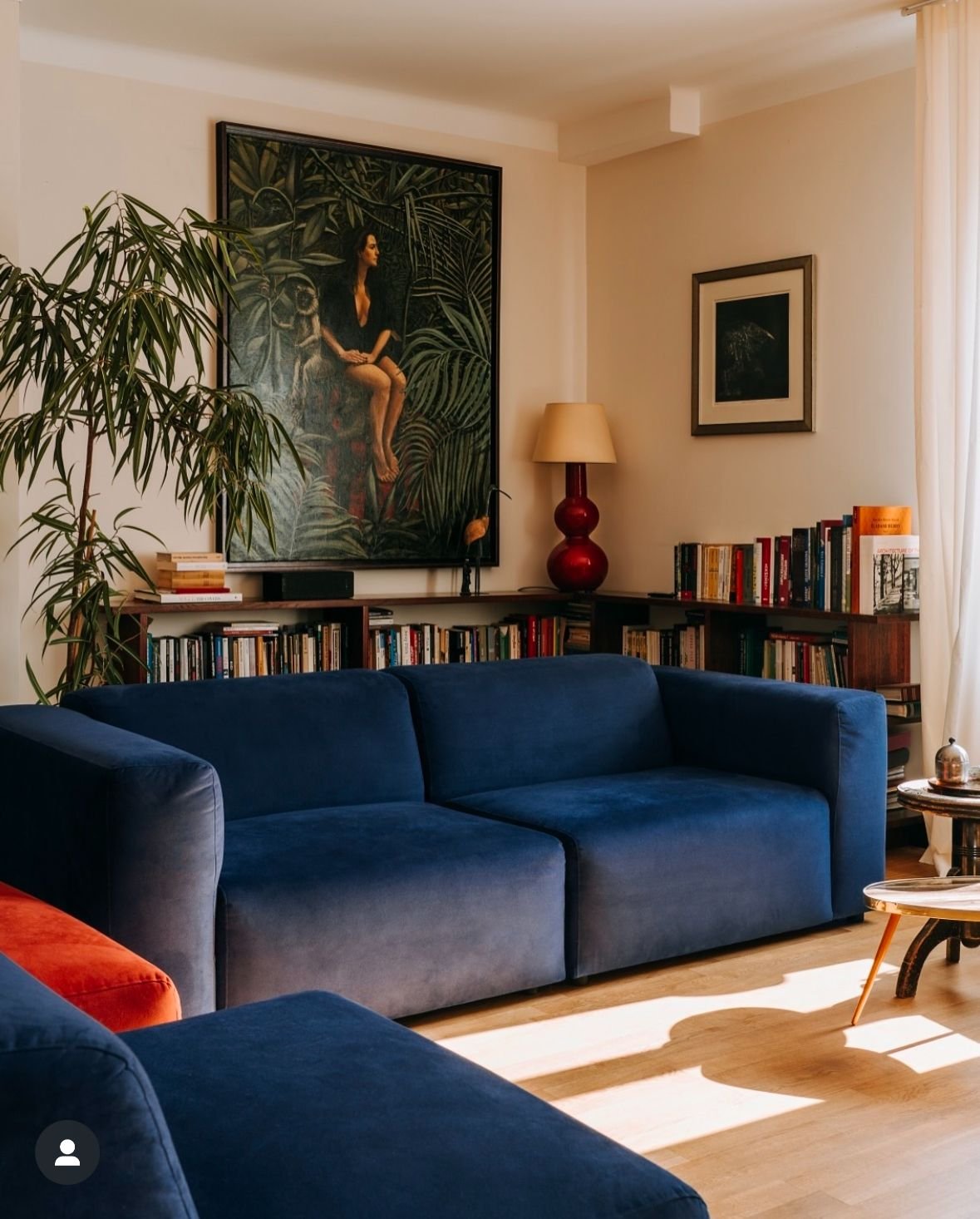 27 Blue Sofas Living Room Ideas That Steal the Show - 27. Statement Wall 1
