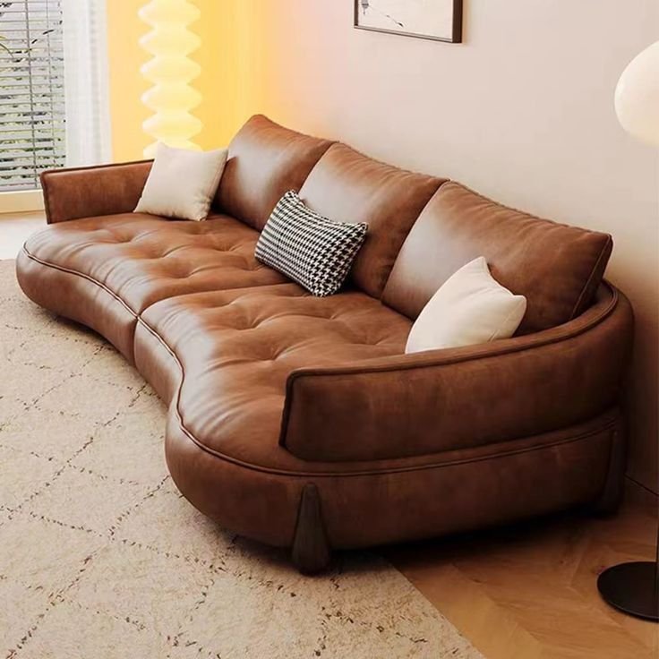 27 Leather Couches Living Room Ideas for Every Aesthetic - 20. Gentle Curves: Sofa with Soft Edges 1