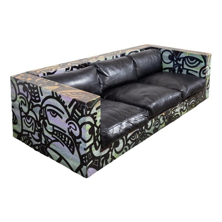 27 Leather Couches Living Room Ideas for Every Aesthetic - 23. Artistic Flair: Leather Couches with Unique Designs 1