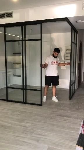 27 Living Room Divider Ideas to Define Your Open Space - 8. Glass Partitions for a Modern Touch 1