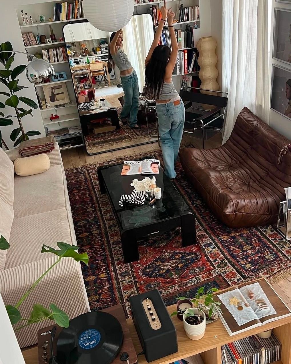 28 Leather Couch Living Room Ideas That Never Go Out of Style - 24. Incorporating Technology Seamlessly 1