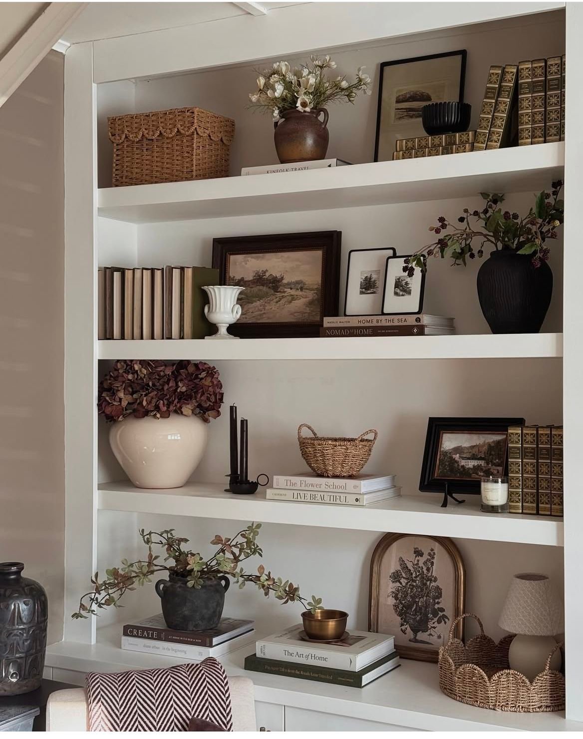 28 Living Room Shelf Ideas That Are Equal Parts Stylish and Functional - 10. Seasonal Shelf Styling 1