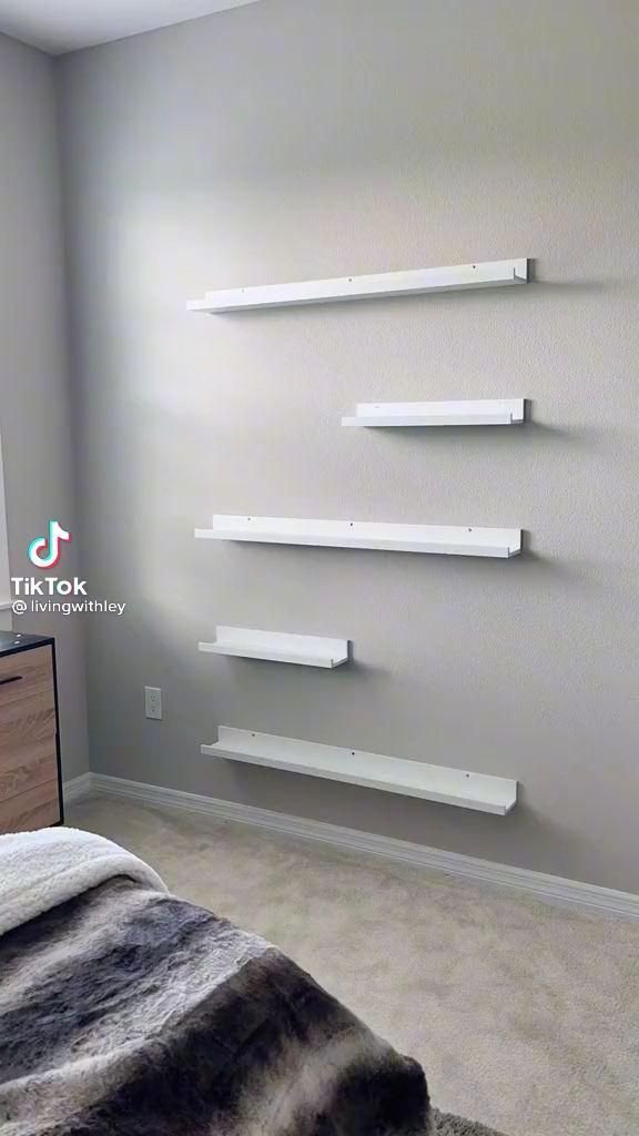 28 Living Room Shelf Ideas That Are Equal Parts Stylish and Functional - 20. Floating Picture Ledges 1