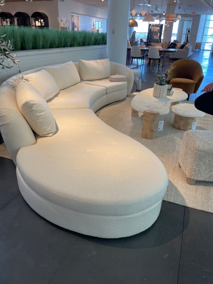 30 Big Couches for Small Living Rooms That Actually Fit - 6. Curved Sofas for Softness 1